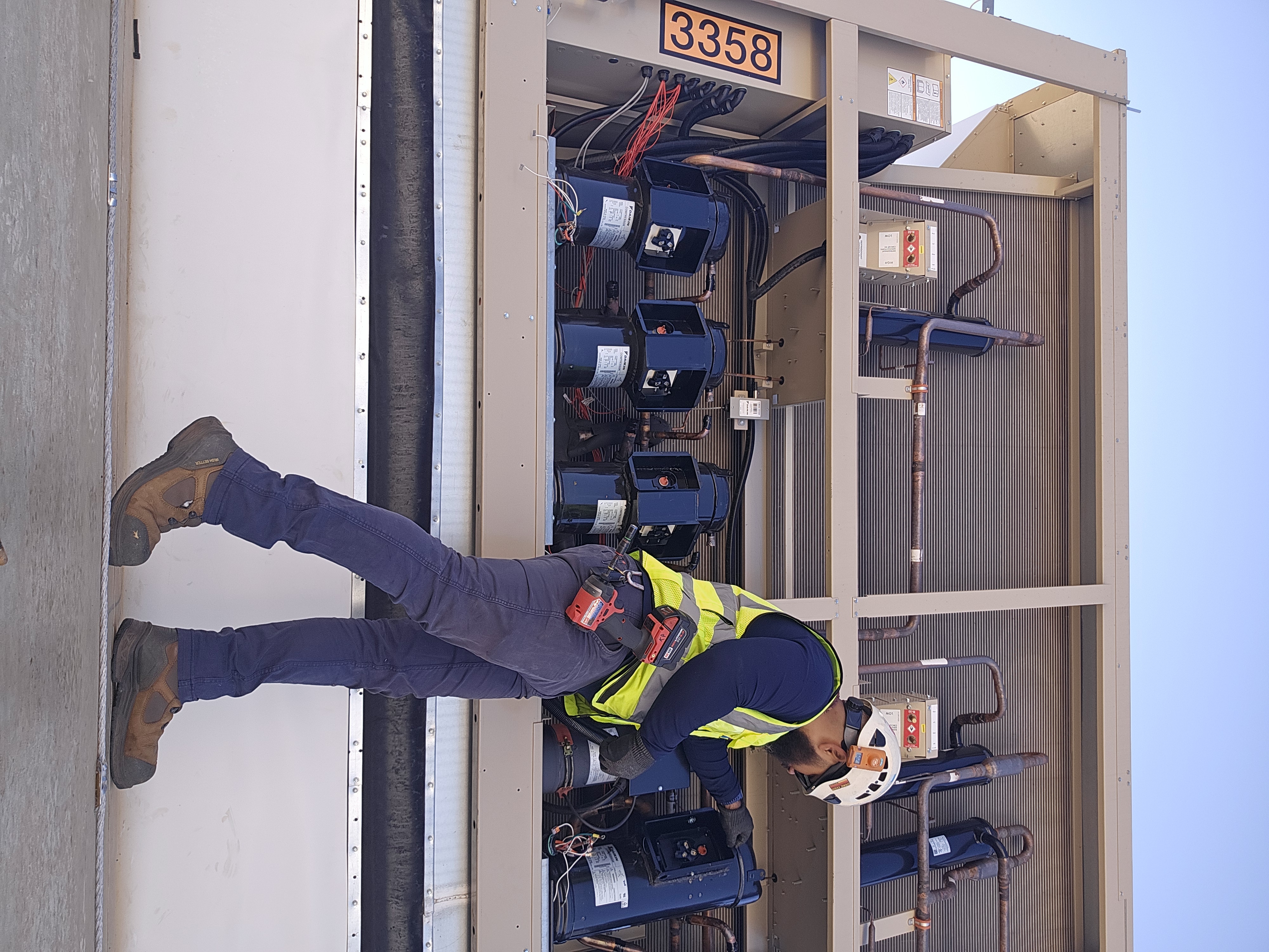 Kelvin from KP Heating & Cooling working on a commercial HVAC unit